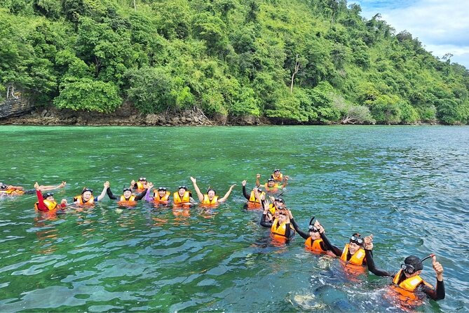 Krabi 4 Islands Speedboat Tour Snorkeling and Beach Lunch - Island Stop 2: Chicken Island snorkeling with a fun-shaped backdrop