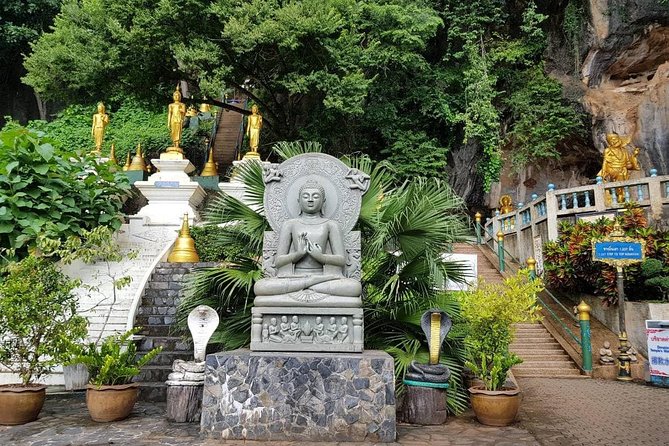 Krabi Emerald Pool, Hot Spring and Tiger Temple - Krabi Tiger Temple: cave paw prints, Buddha statues, and stair stamina